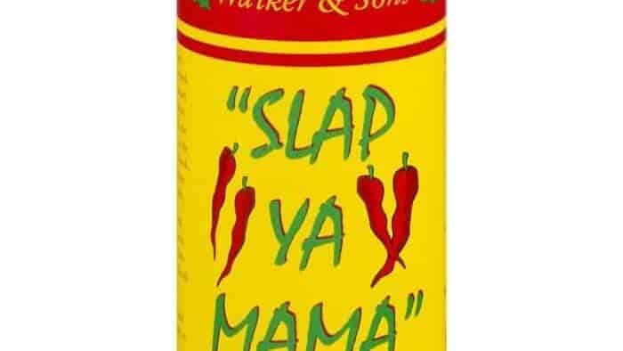 Louisiana Cajun seasoning can with red peppers and yellow label.