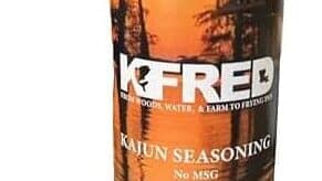 FREDFIRE Cajun seasoning container with sunset background, no MSG, Louisiana flavor.